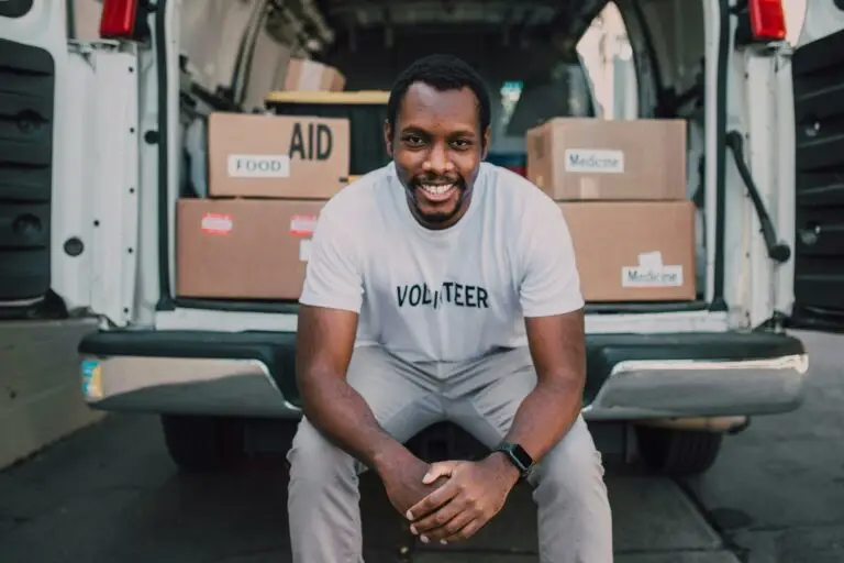 A man sitting at the back of a white van