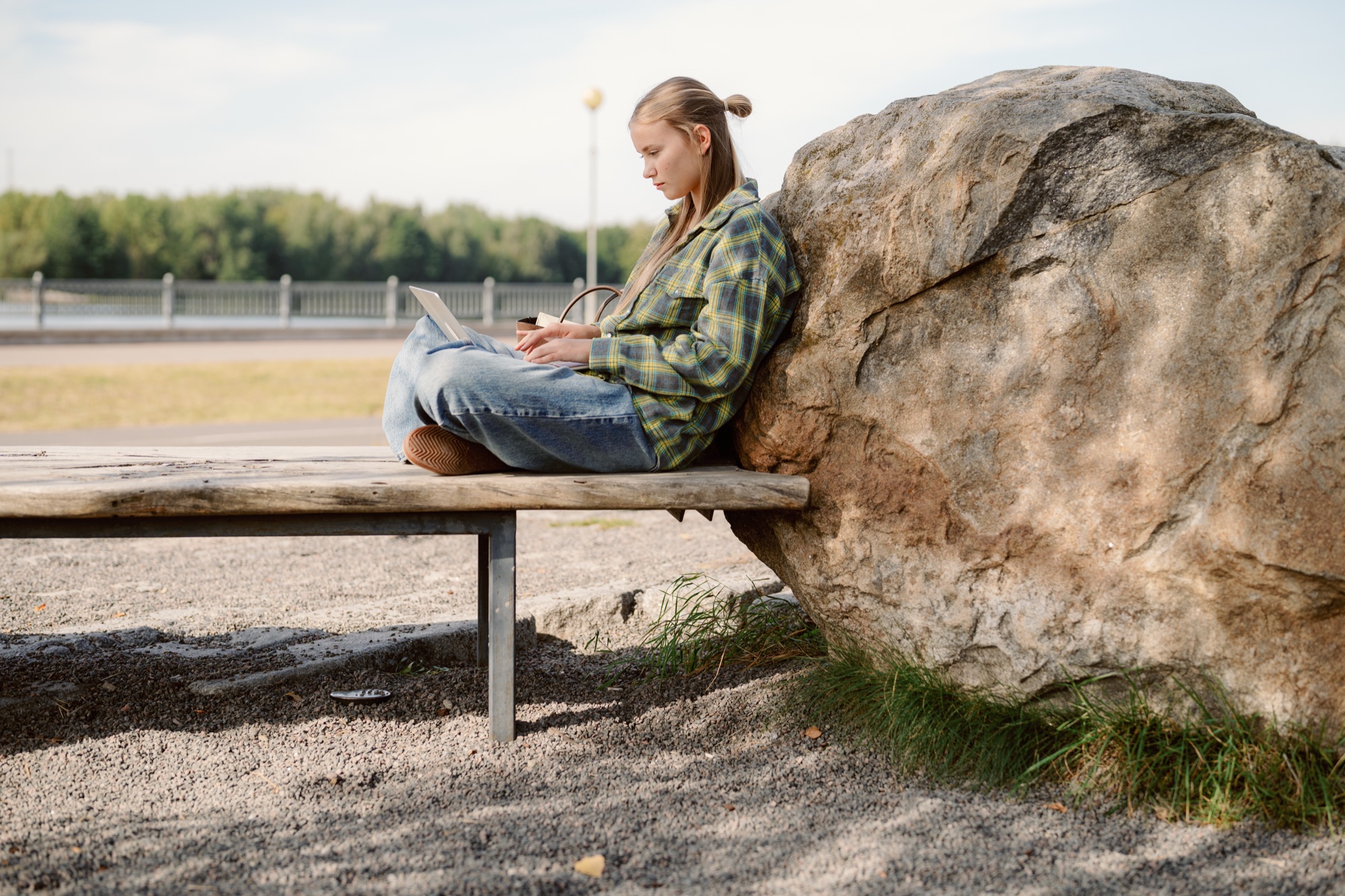 Woman working on a laptop outdoors