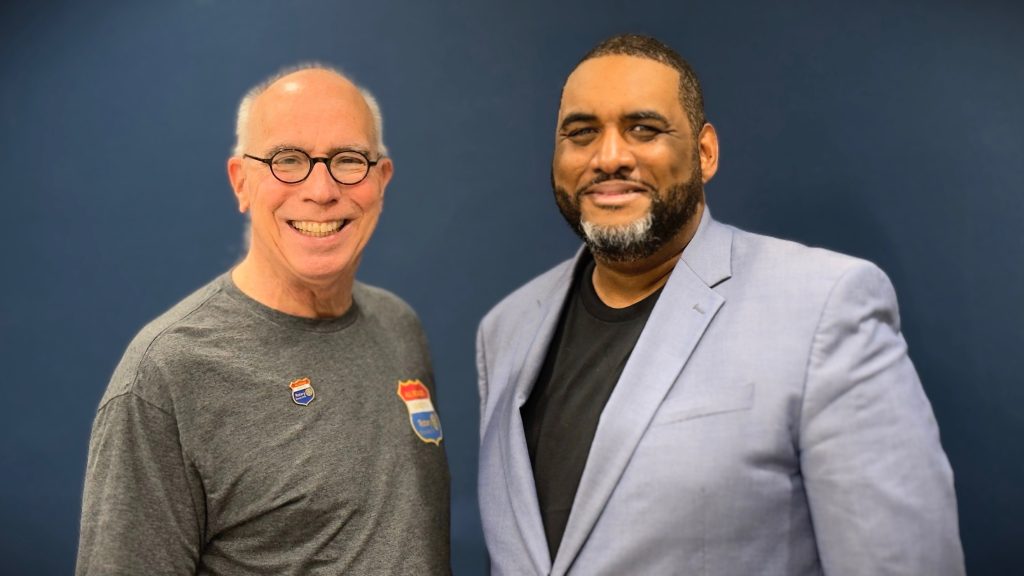 Wade Dunn Jr. with a member of the Rotary Club of Tulsa Sunrise