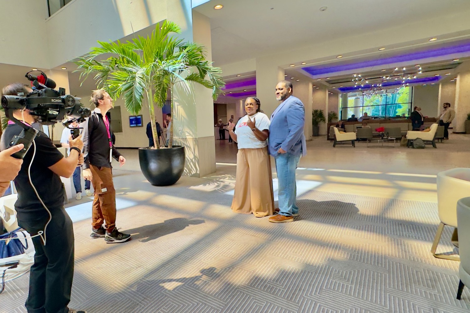 Koddi Dunn and Wade Dunn Jr., co-founders of Love Mobile, filmed for an interview by a camera crew in Miami, Florida
